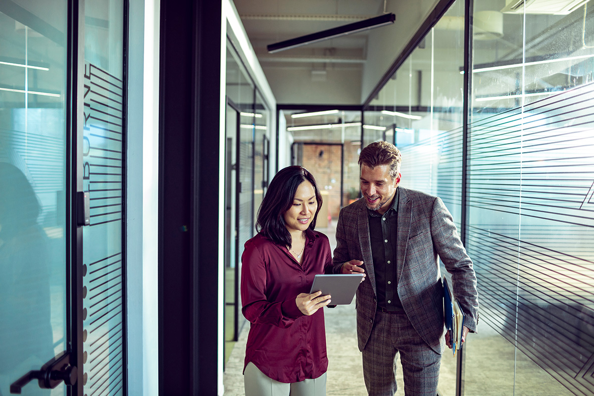 Close up of two business people having a quick chat outside the office